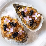 Oyster with a dashi beurre blanc & chicken skin 1 Oyster with a dashi beurre blanc & chicken skin