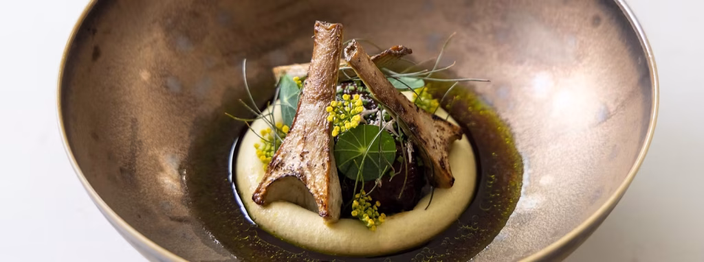 braised veal or beef cheek dish with delicious artichokes and lovage